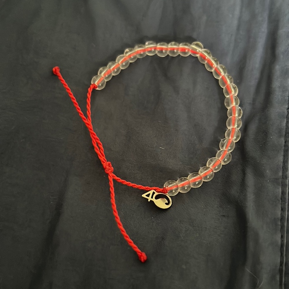 4Ocean red intertwined string.